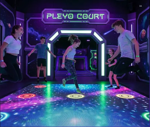 Neon-lit Planet Jump trampoline park interior with glowing courts and lounge seating.